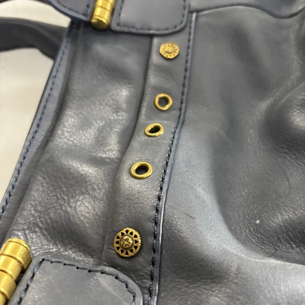 The Sak Serena Leather Handbag Navy Blue Tobacco Souk Floral Embossed